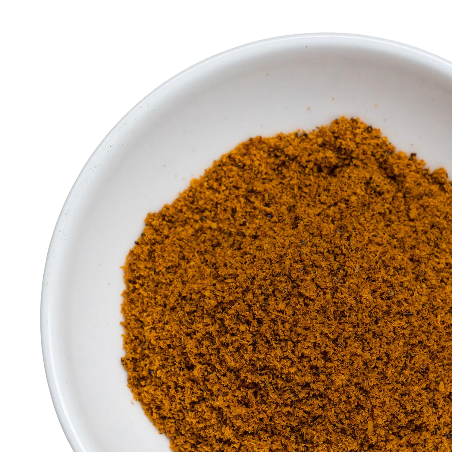 Eine weiße Schüssel, gefüllt mit getrocknetem Sanddornpulver.