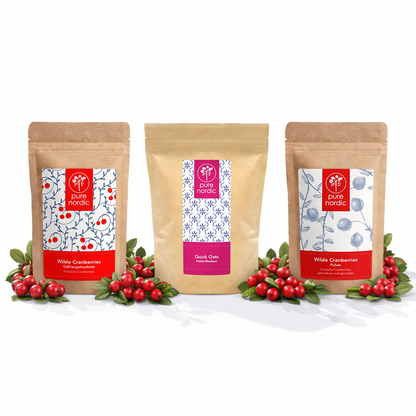Dre Pure Nordic Beutel mit Cranberries und Haferflocken, umgeben von roten Beeren.